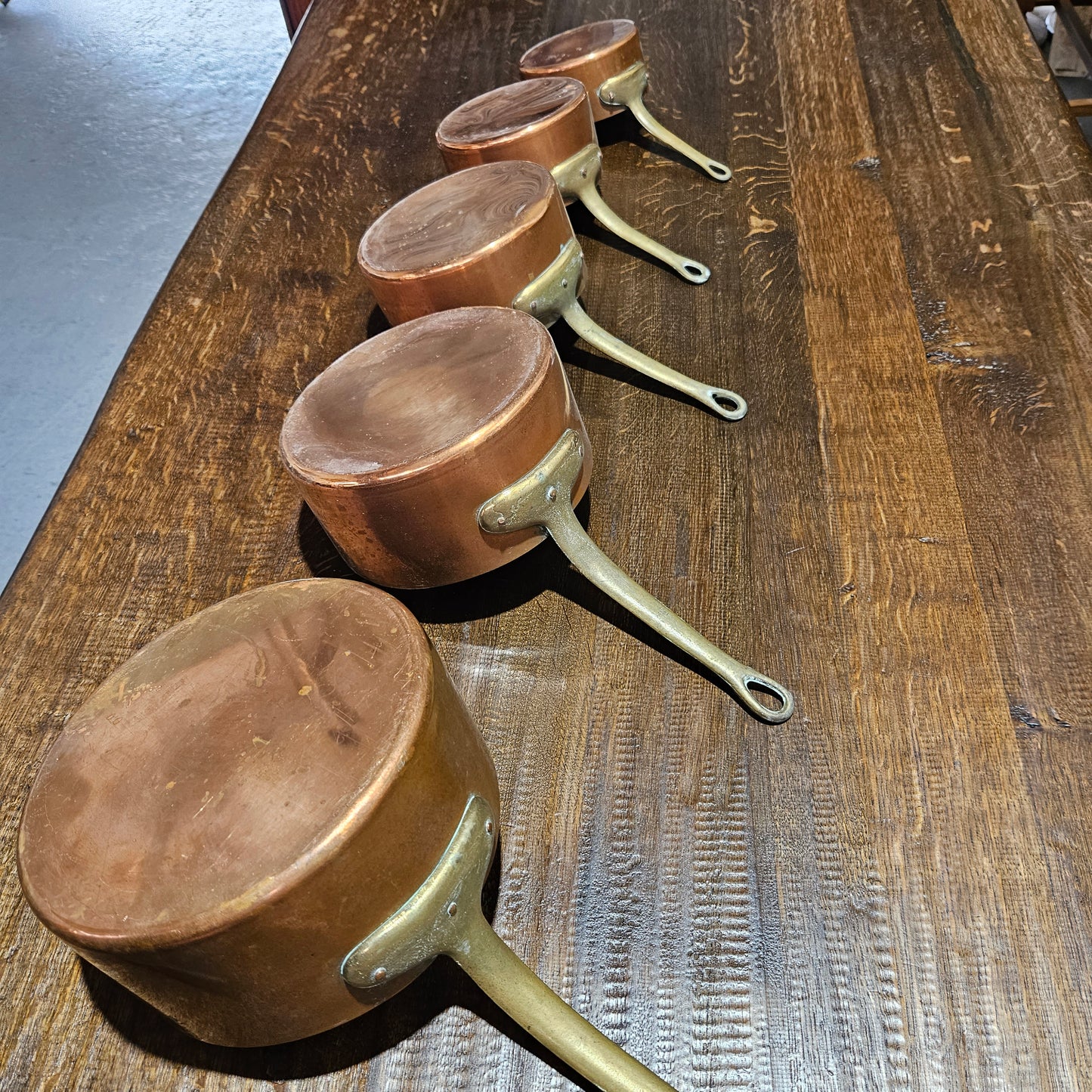 Lovely set of five copper sauce pots, they are all in good original condition for the age. Sourced from France.