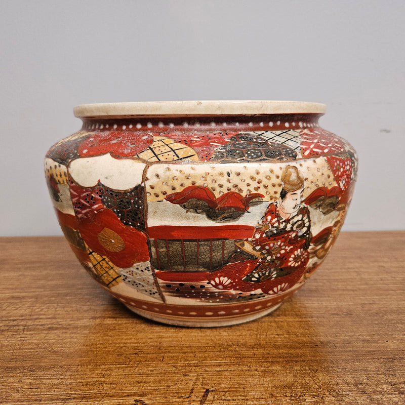 Antique Satsuma hand painted jardinière pot. It is signed and has some crazing. In good condition.