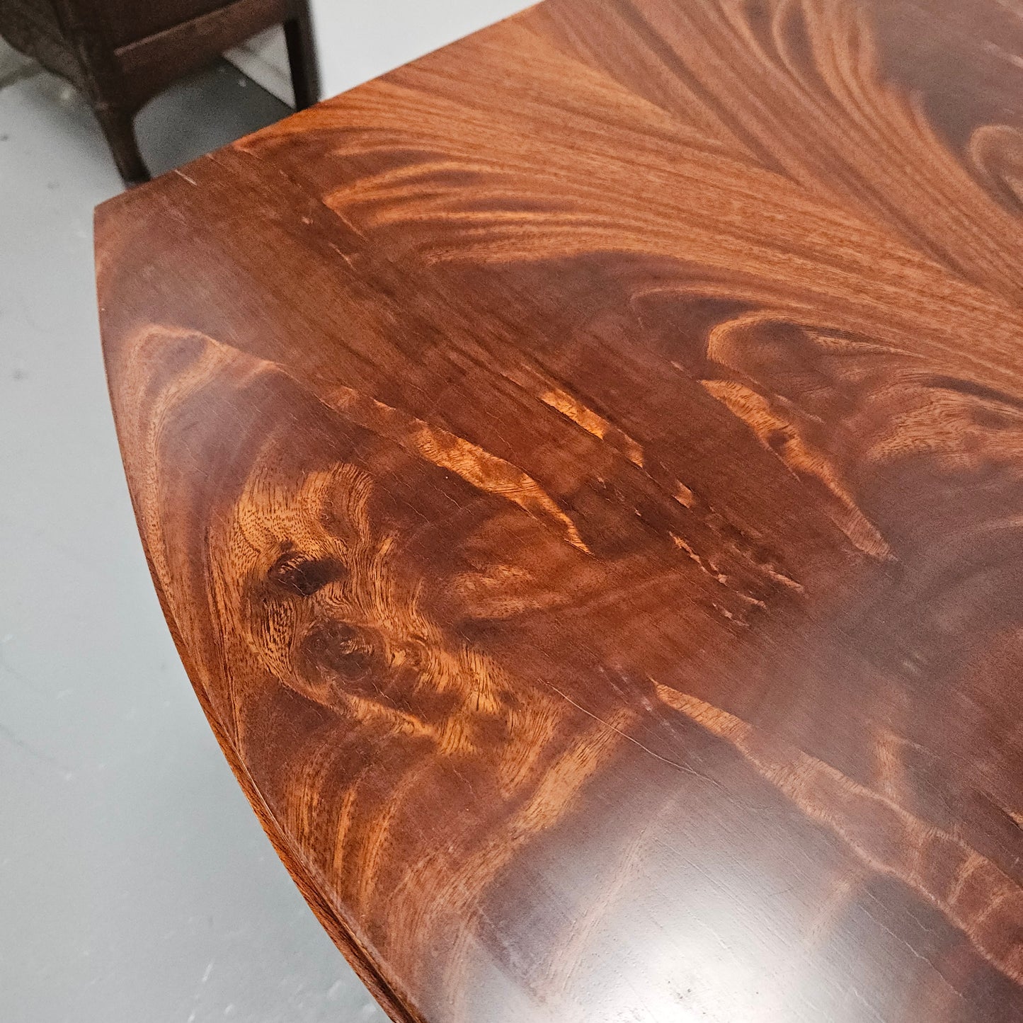 French Art Deco flame mahogany center table. Sourced directly from France it is in good original detailed condition. Circa 1930's