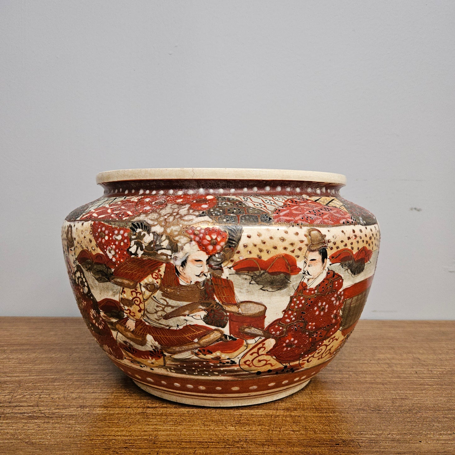 Antique Satsuma hand painted jardinière pot.  It is signed and has some crazing. In good condition.