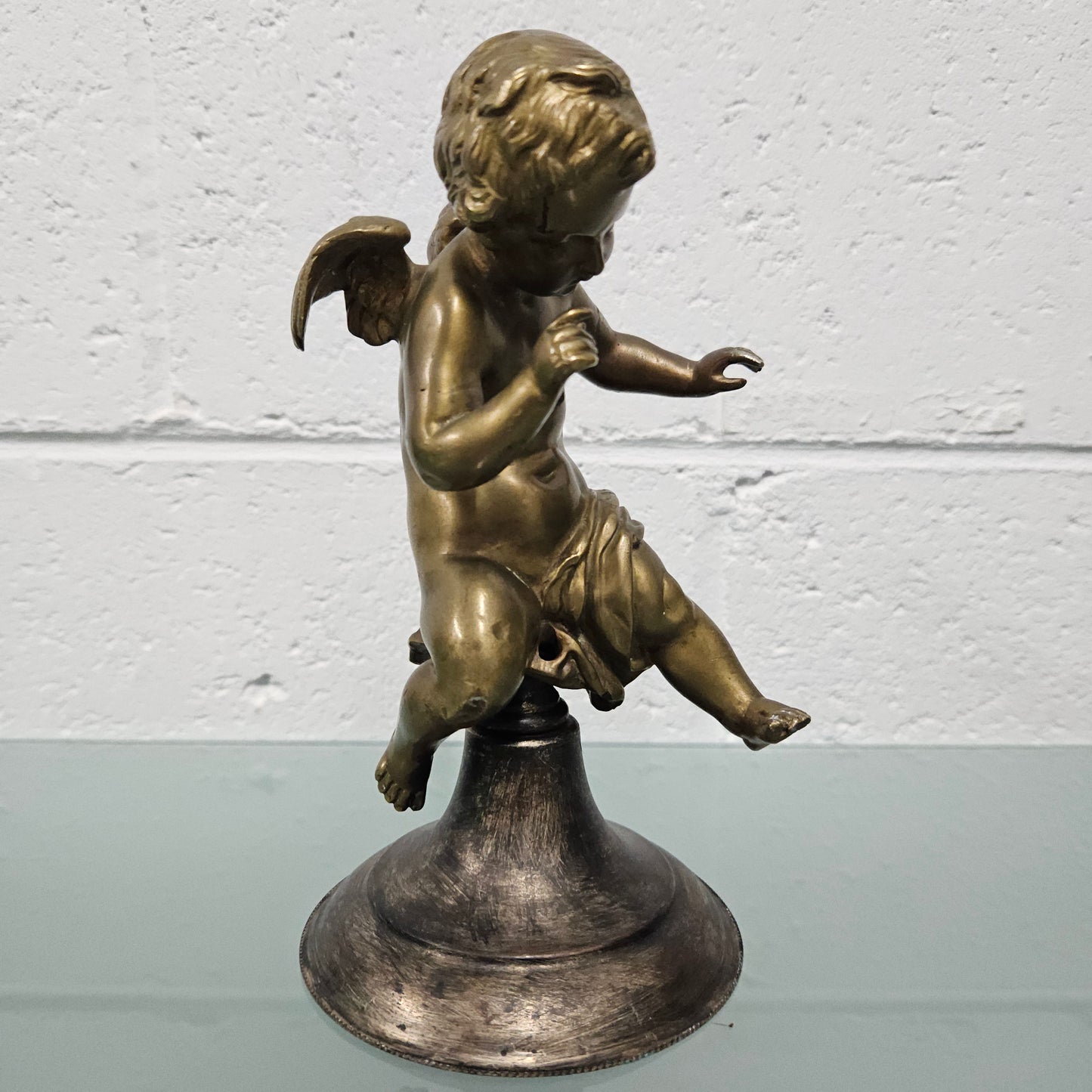 Attractive bronze winged cherub Circa: 1900. In good original condition.