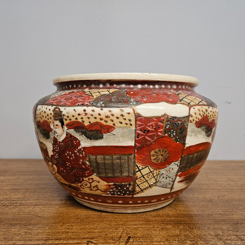 Antique Satsuma hand painted jardinière pot. It is signed and has some crazing. In good condition.