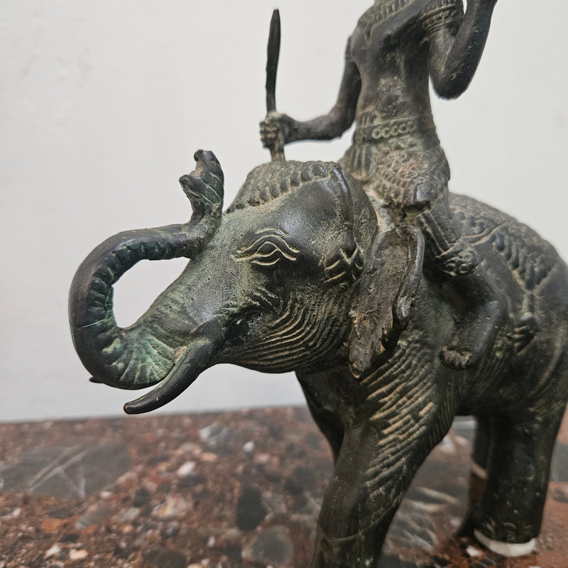 Heavy Vintage Bronze elephant with God riding on top. It has beautiful details and is in good original condition with signs on age.