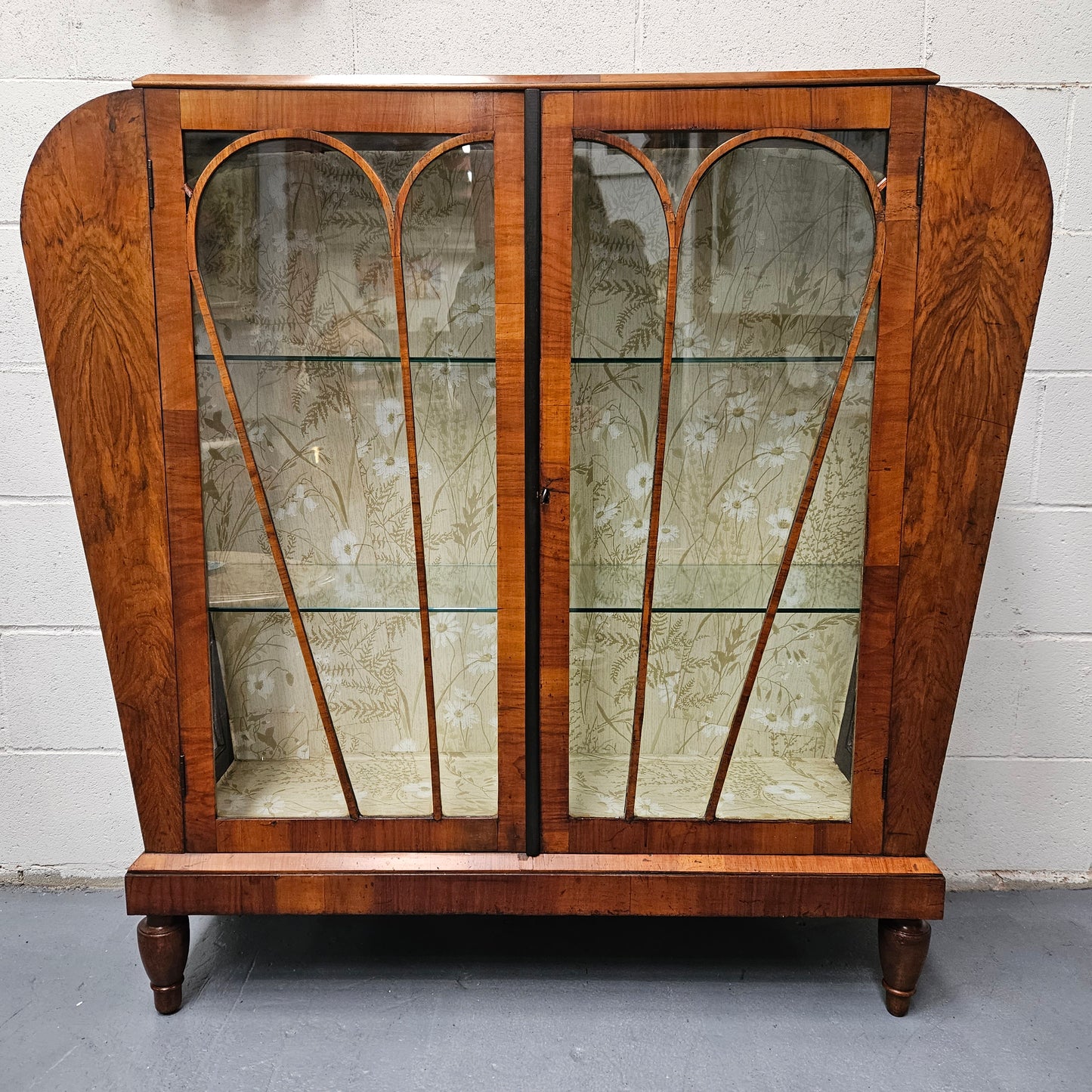 Stunning Art Deco display cabinet with two glass shelfs, Walnut and lockable glass doors. This cabinet is in great original condition for the age.