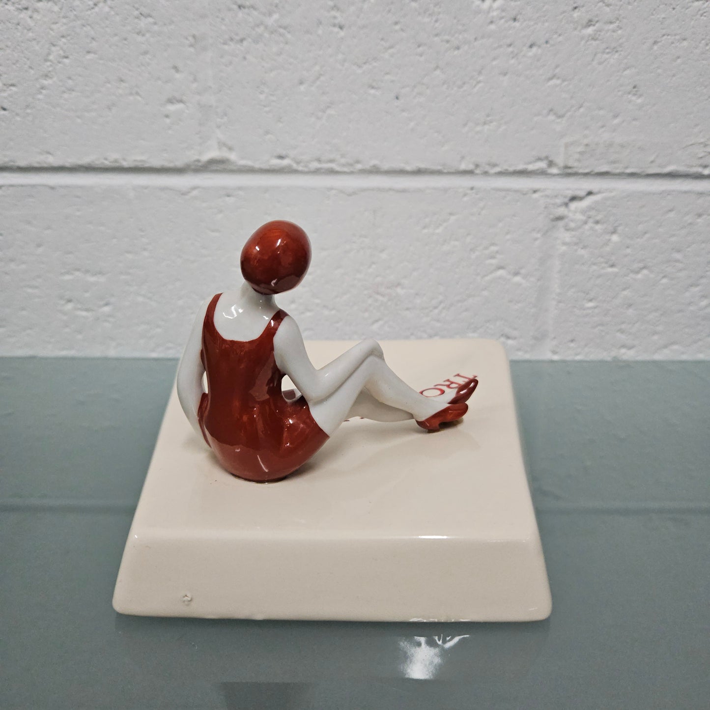 Unusual vintage female figure on large ceramic base. Souvenir Trouville De Normandie. Circa: 1950's. Could be used for keys, change or decoration. In good original condition.