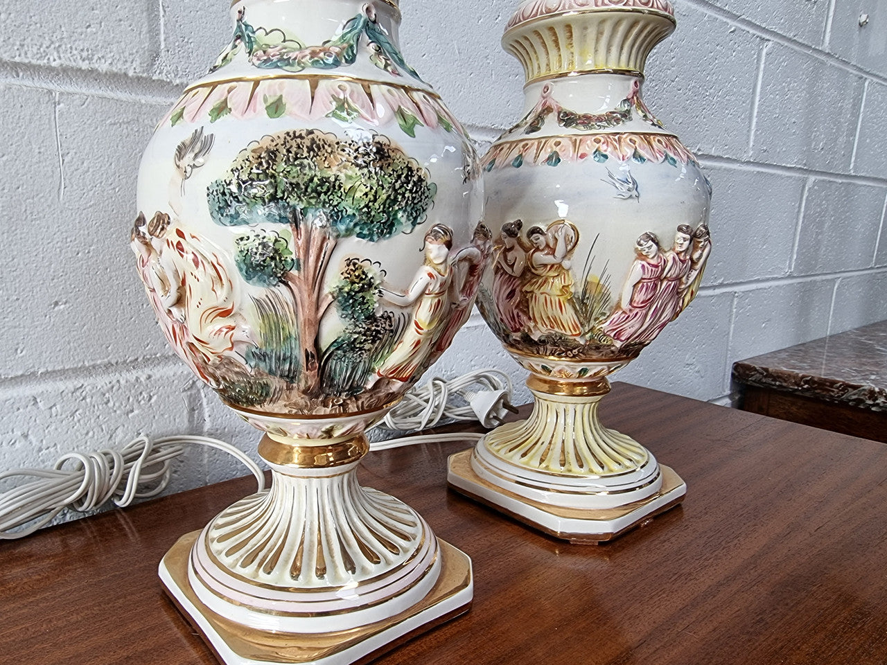 Pair of hand painted capodimonte vintage table lamps. In good original detailed working condition.