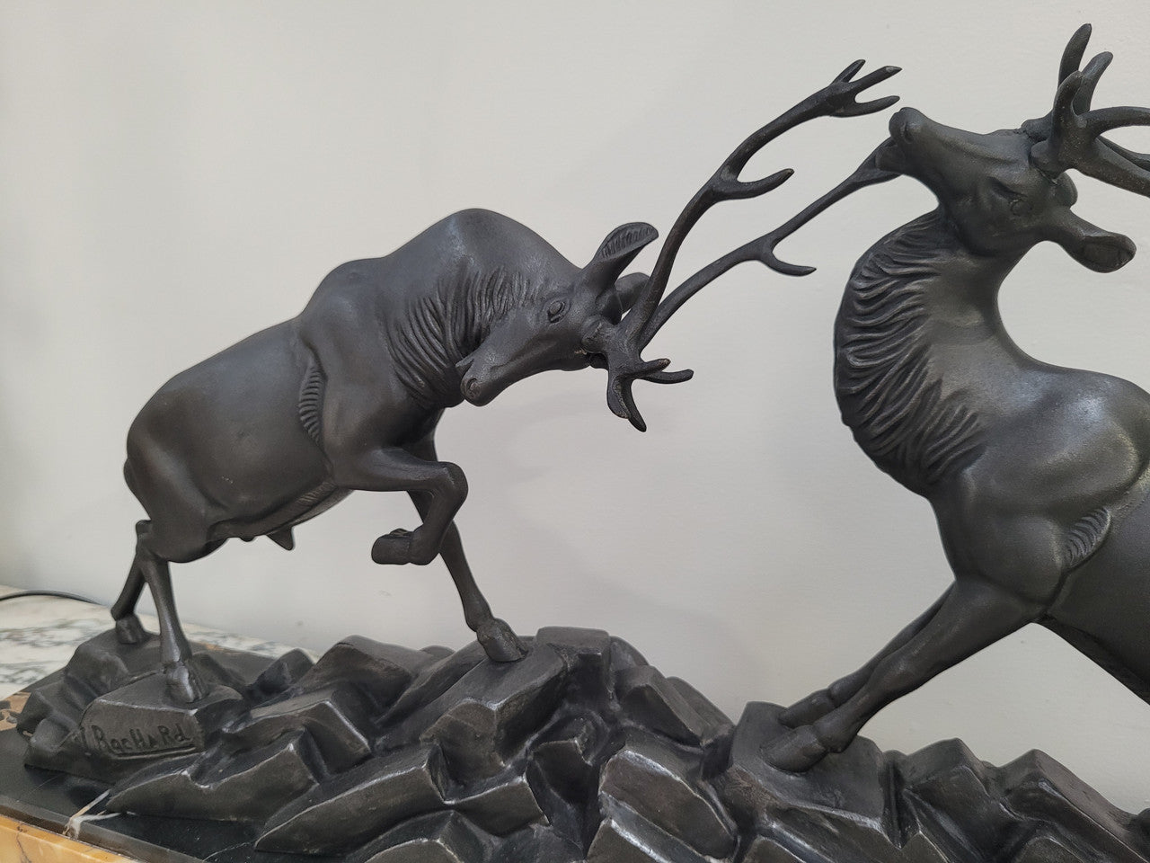 French Art Deco bronzed spelter and marble"Fighting Stags" statue by renowned artist and sculptor "Irenee Rochard".