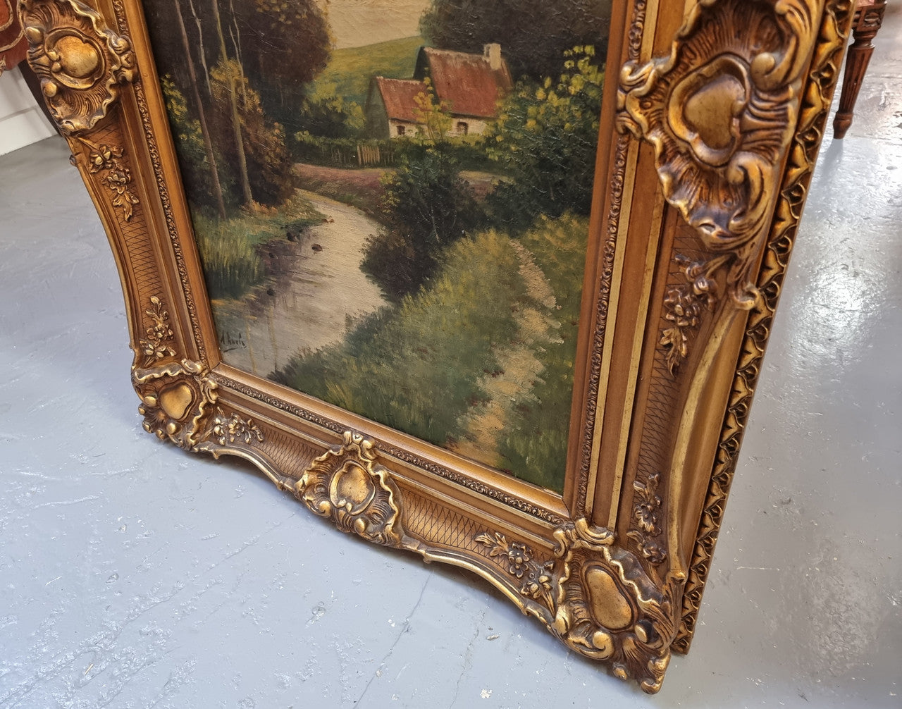 Lovely signed landscape river scene oil on canvas framed in a beautiful ornate frame and in good original condition.