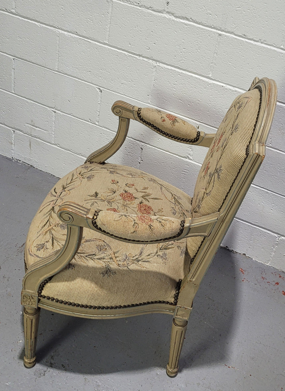 Lovely French Louis XVI style painted and Tapestry upholstered fauteuil. In good original condition, and very comfortable.