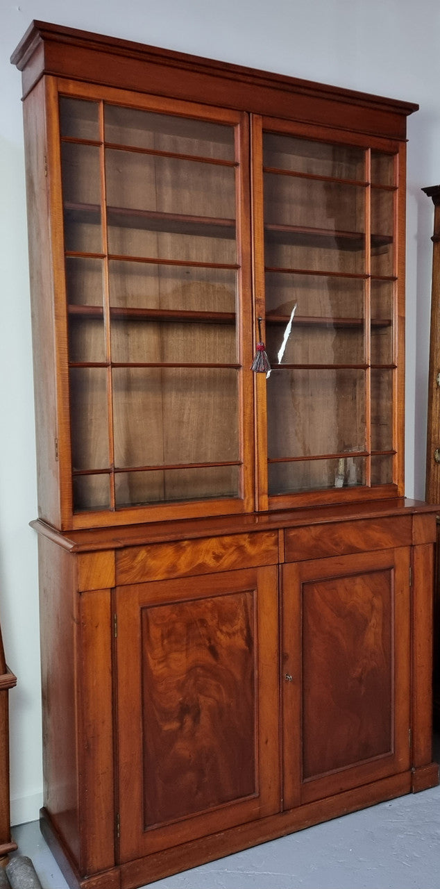 Rare early Australian colonial full Cedar bookcase. Plenty of storage underneath and glass top doors open up too three fully adjustable shelves. In good restored condition.