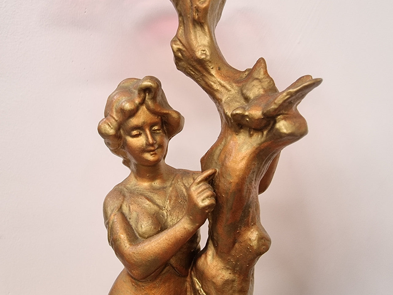 Late Victorian spelter table Centerpiece/comport featuring a woman holding an opalescent and ruby glass bowl. In good original condition with no damage to the ruby bowl.