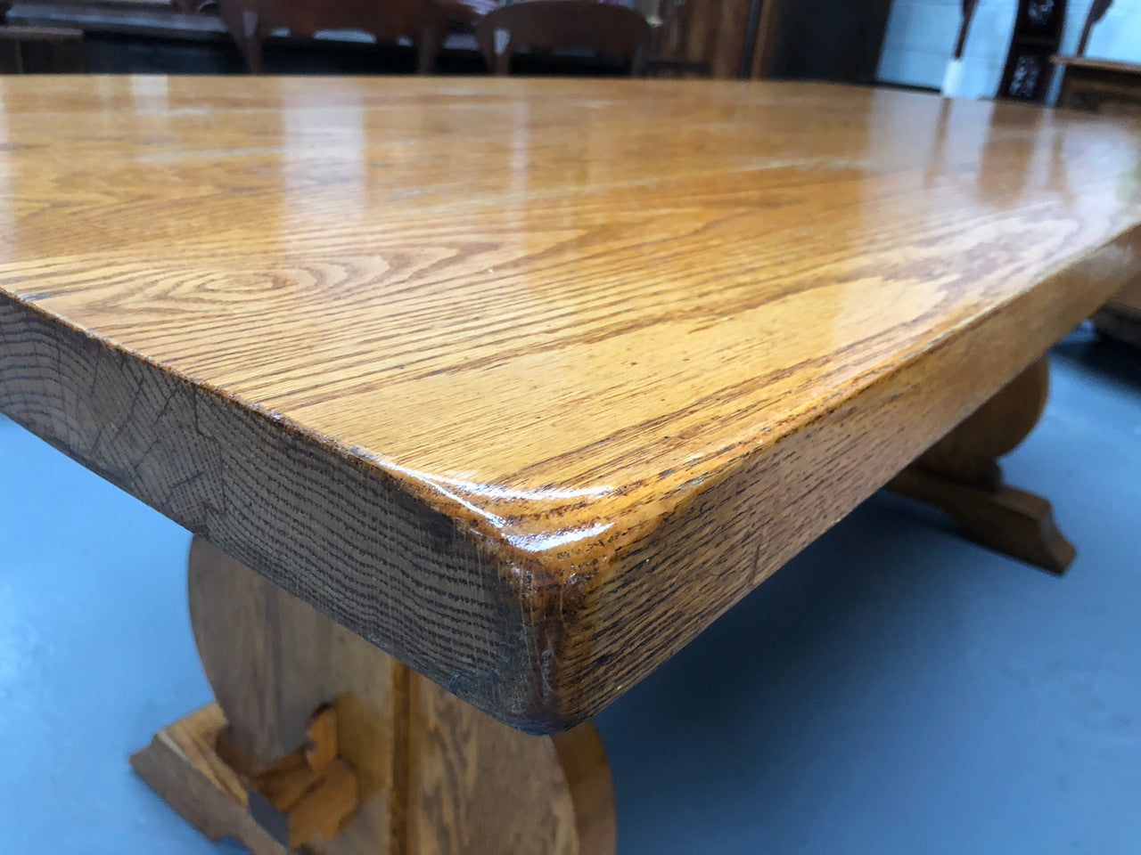 A French Style Oak stretcher base table with amazing wood grain. Can comfortable sit 6-8 people and is in original detailed condition.