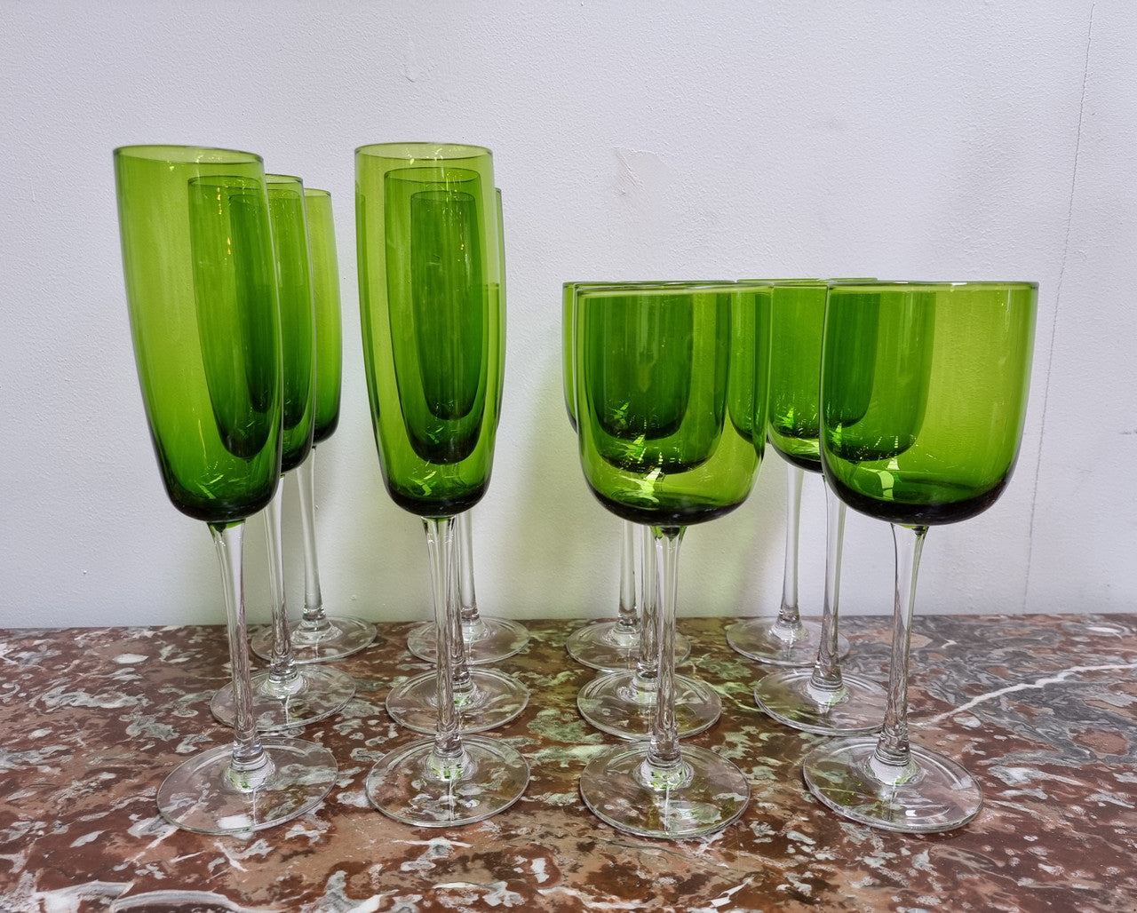 Beautiful set of 12 Vintage emerald green hand made wine glasses. Possibly Italian or French. They are in good original condition with no chips or cracks.