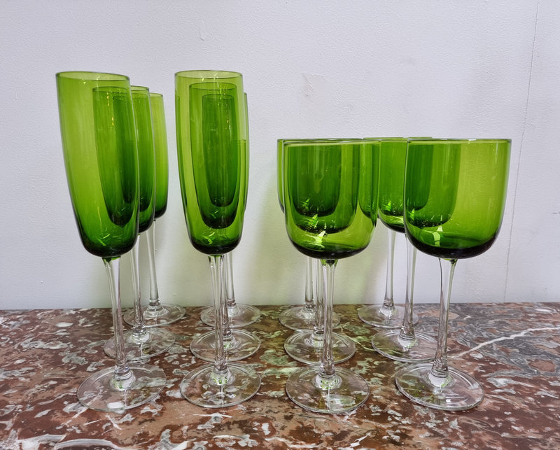 Beautiful set of 12 Vintage emerald green hand made wine glasses. Possibly Italian or French. They are in good original condition with no chips or cracks.