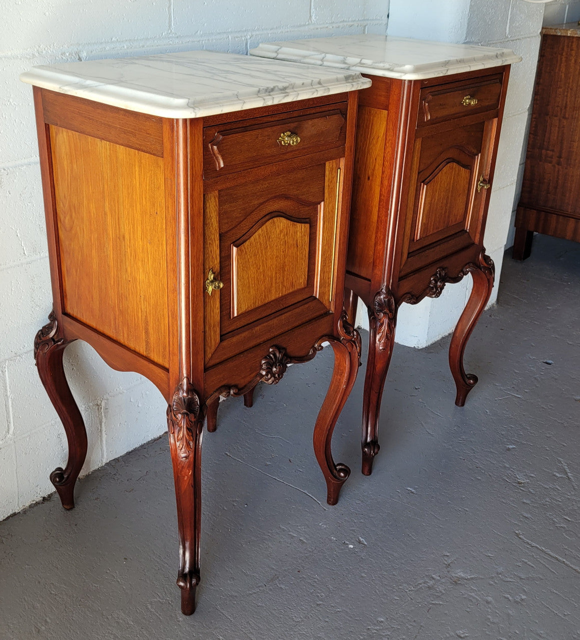 Pair of Louis XV style Walnut bedside cabinets marble top. Circa 1900 and in good original detailed condition.