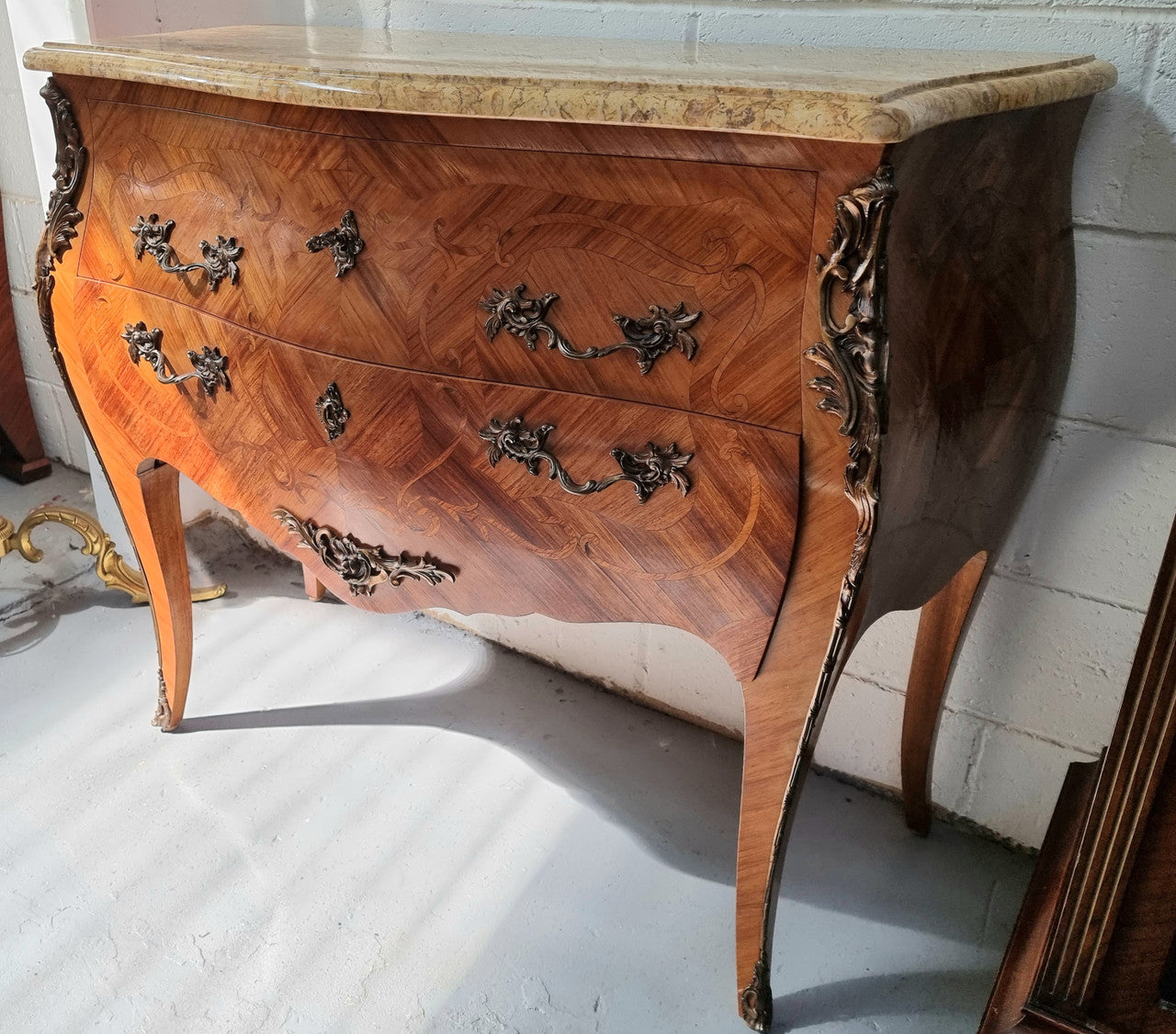French marquetry inlaid Kingwood marble top commode. It has two drawers and beautiful mounts. Is in good original detailed condition.