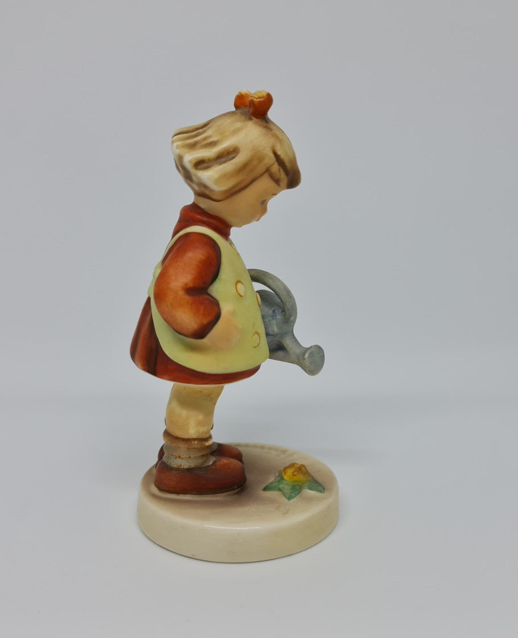 Gorgeous Hummel girl with watering can figurine, marked #74 . In great original condition.