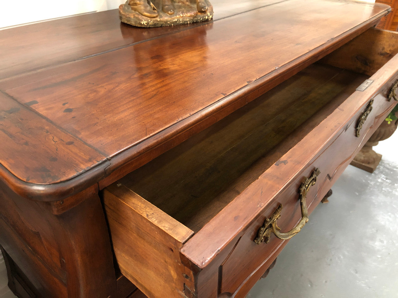 Beautiful 18th Century French all Cherrywood three drawer commode with beautiful ormolu mounts and handles. It is in good original detailed condition.