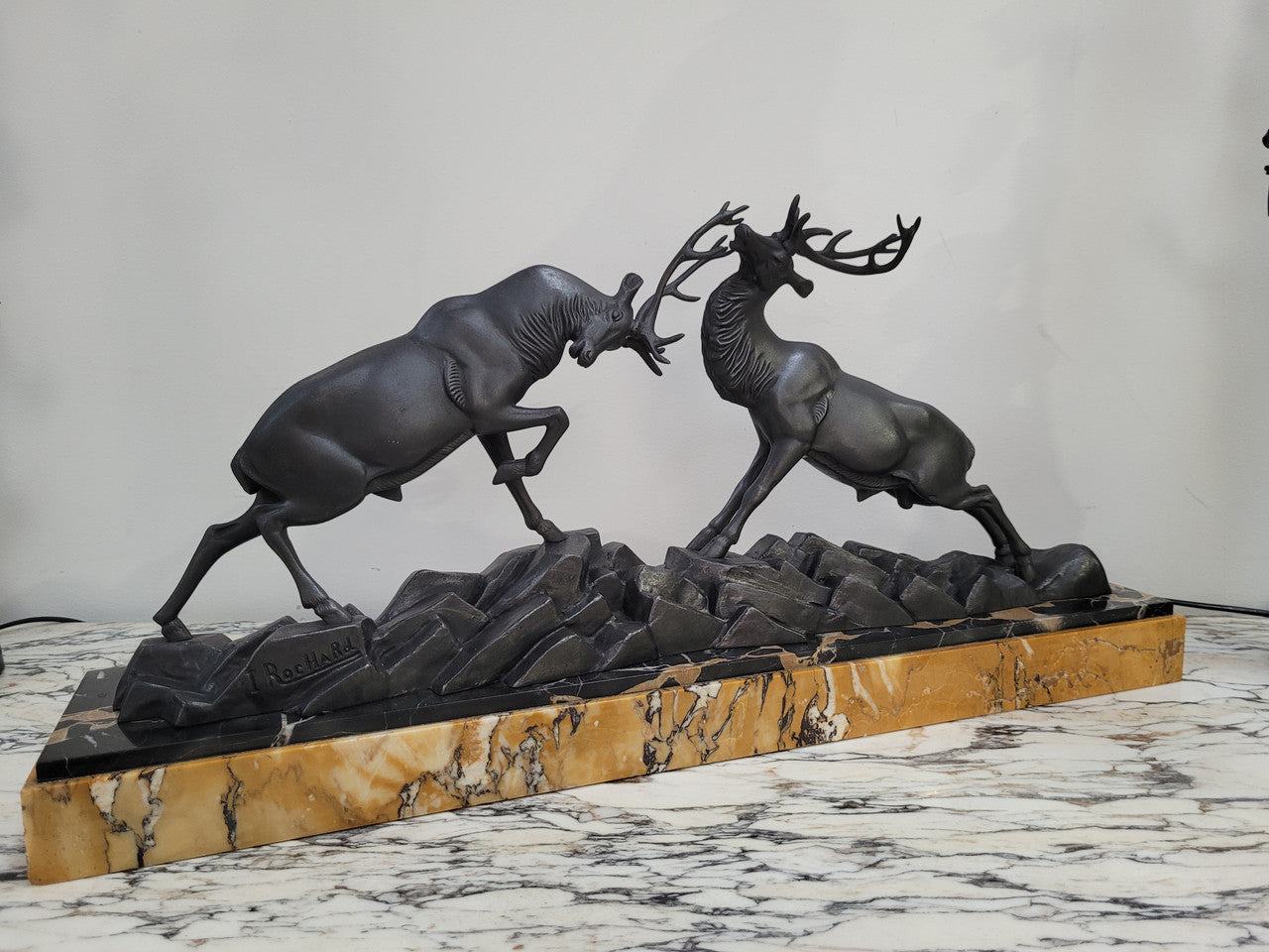 French Art Deco bronzed spelter and marble"Fighting Stags" statue by renowned artist and sculptor "Irenee Rochard".