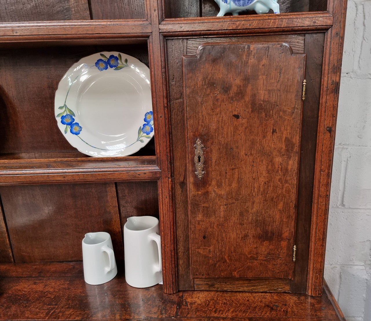 18th Century English Oak Farmhouse dresser of grand proportions. It was sourced in France and not only looks amazing but also has plenty of practical storage space. It is in good original detailed condition.