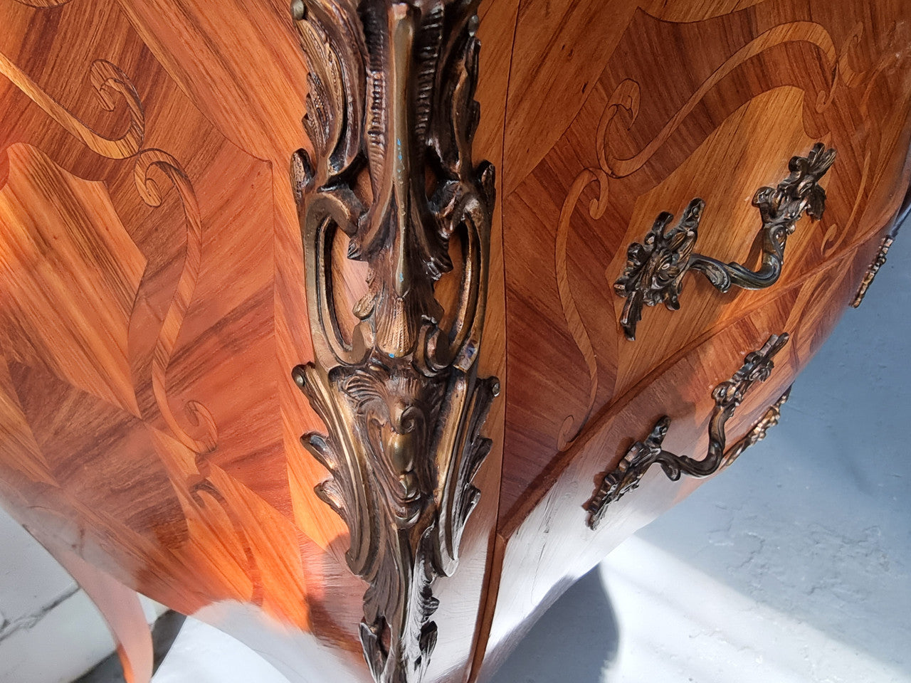 French marquetry inlaid Kingwood marble top commode. It has two drawers and beautiful mounts. Is in good original detailed condition.
