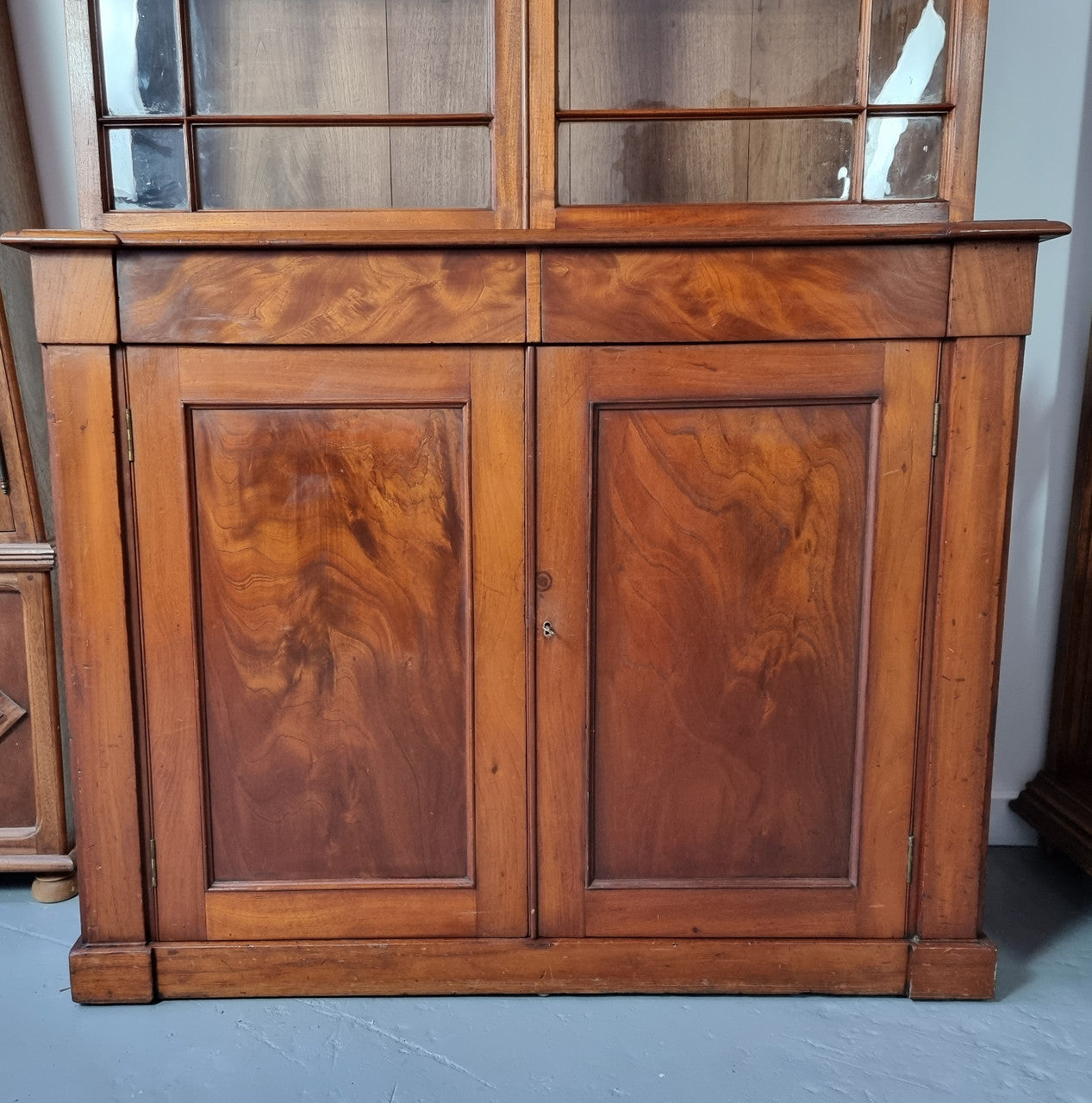 Rare early Australian colonial full Cedar bookcase. Plenty of storage underneath and glass top doors open up too three fully adjustable shelves. In good restored condition.