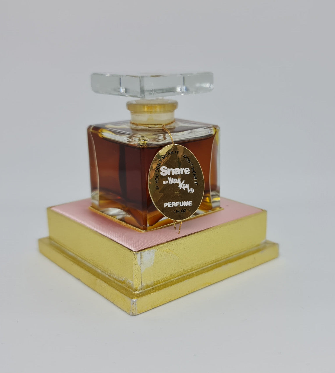 Beautiful Vintage snare "Mary Kay" French bottle of perfume. It is in amazing condition. Comes with pink and gold tray.