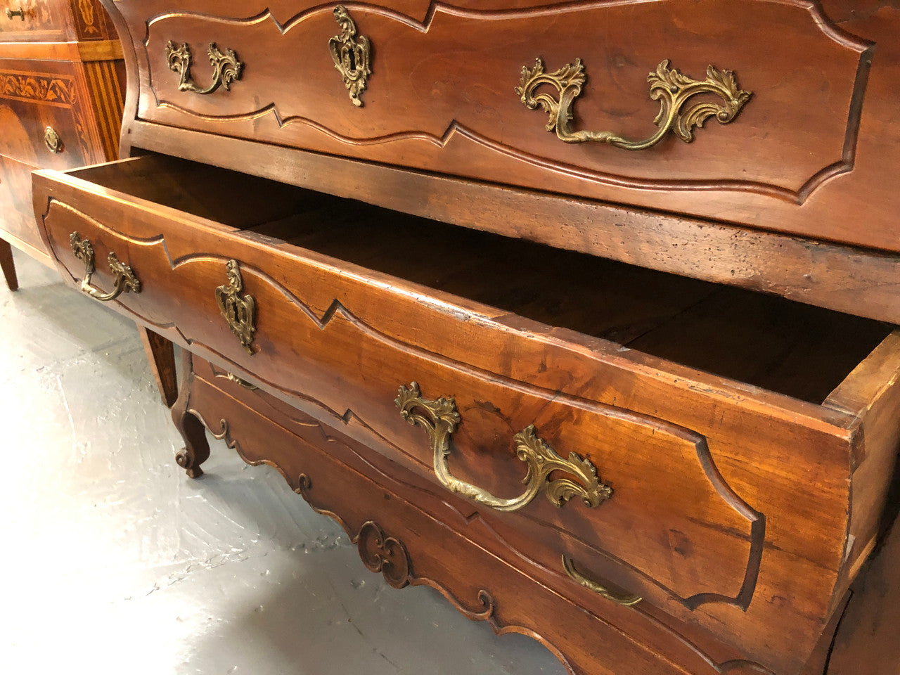Beautiful 18th Century French all Cherrywood three drawer commode with beautiful ormolu mounts and handles. It is in good original detailed condition.
