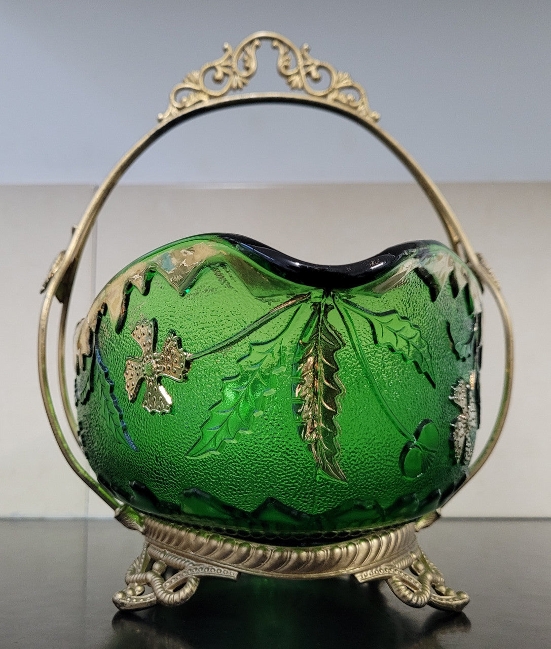 Victorian emerald green and gilt decorated glass bowl with ornate gilt metal stand. It is in good original condition, please view photos as they help form part of the description.