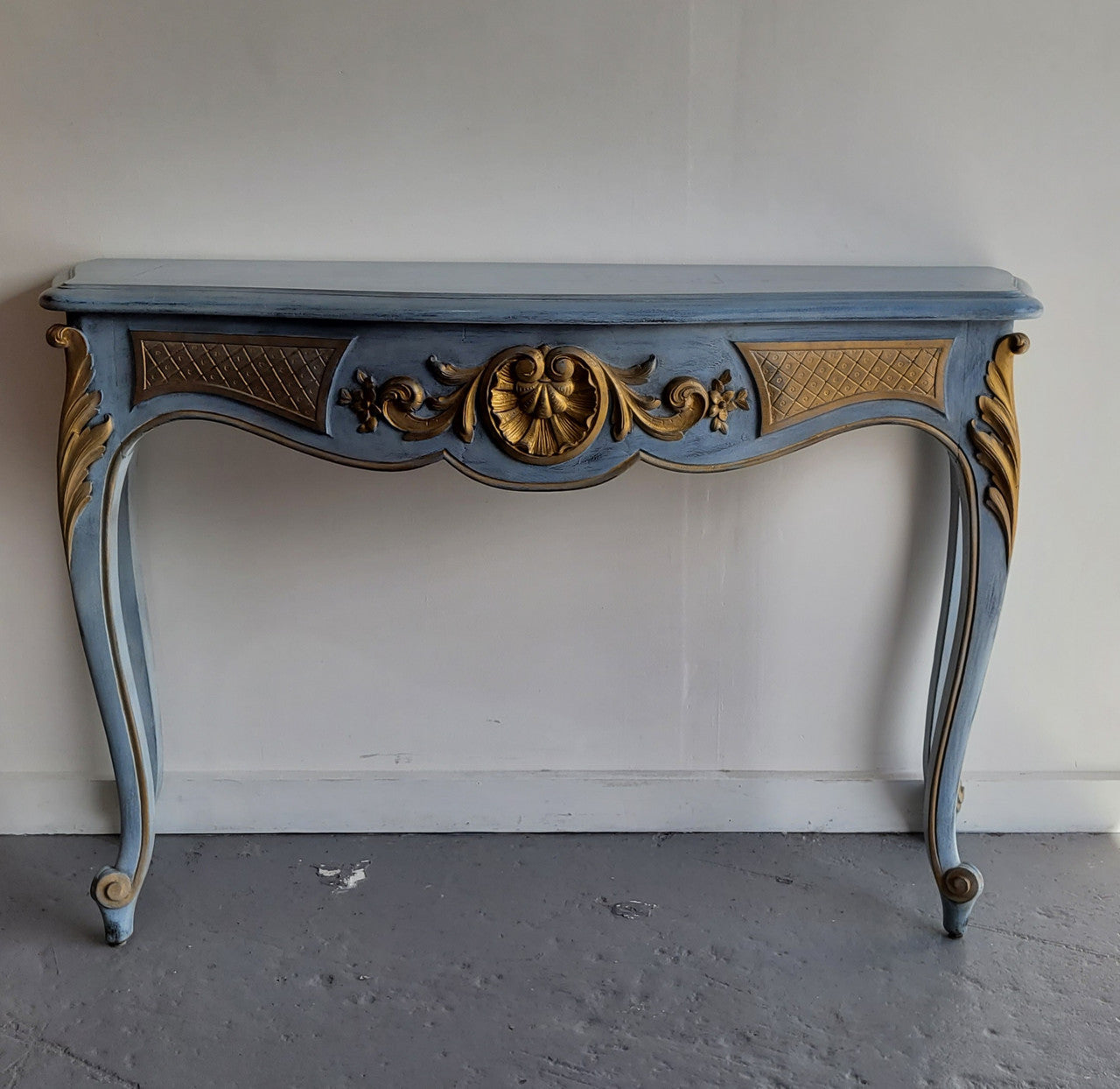 Stylish Louis 15th style console table with chalk paint and gilded highlights. They have been sourced from France and is in good original condition.