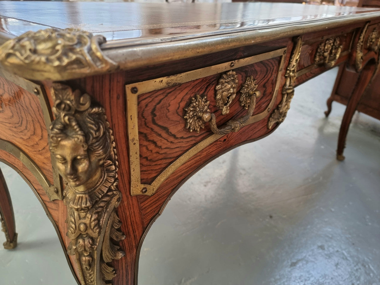 Beautifully fully restored French Antique Rosewood partners desk with beautiful ormolu detail and lovely tooled new leather top. There are three functioning drawers on one side for all your storage needs.
