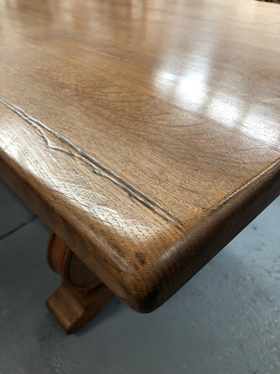 French oak fixed farmhouse table with a charming harp-shaped base. In good original condition and can seat 6-8 people. Circa 1930.