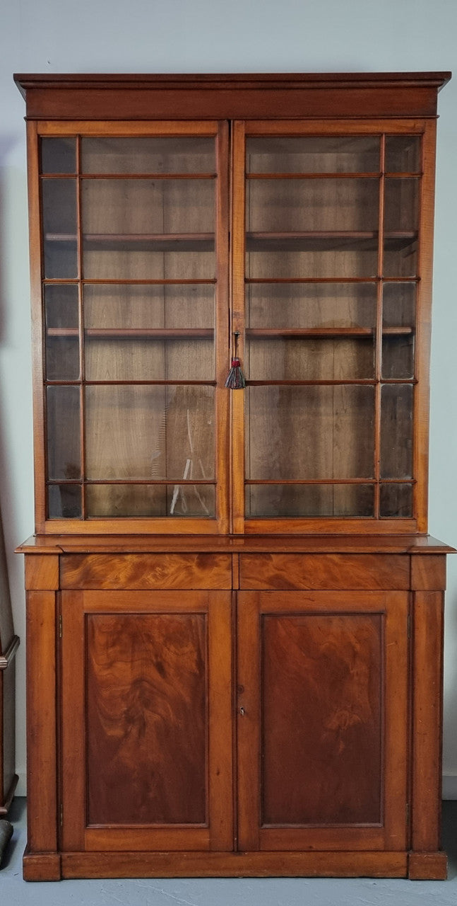 Rare early Australian colonial full Cedar bookcase. Plenty of storage underneath and glass top doors open up too three fully adjustable shelves. In good restored condition.