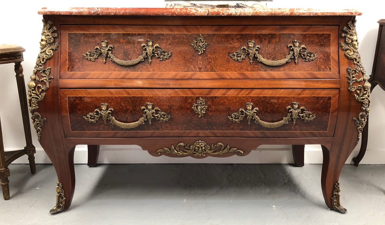 Grande French Louis XIV style Amboyna and walnut two drawer marble top commode, with amazing detailed ormolu mounts, and sienna colour marble top. In good original detailed condition.