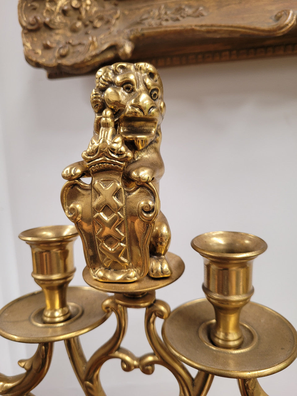 Pair of large Antique French Brass candelabras with lions. They have been sourced from France and are in good original detailed condition.
