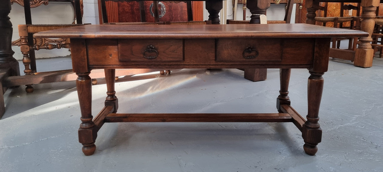 Beautiful French oak 2 drawer coffee table. In good original detailed condition.