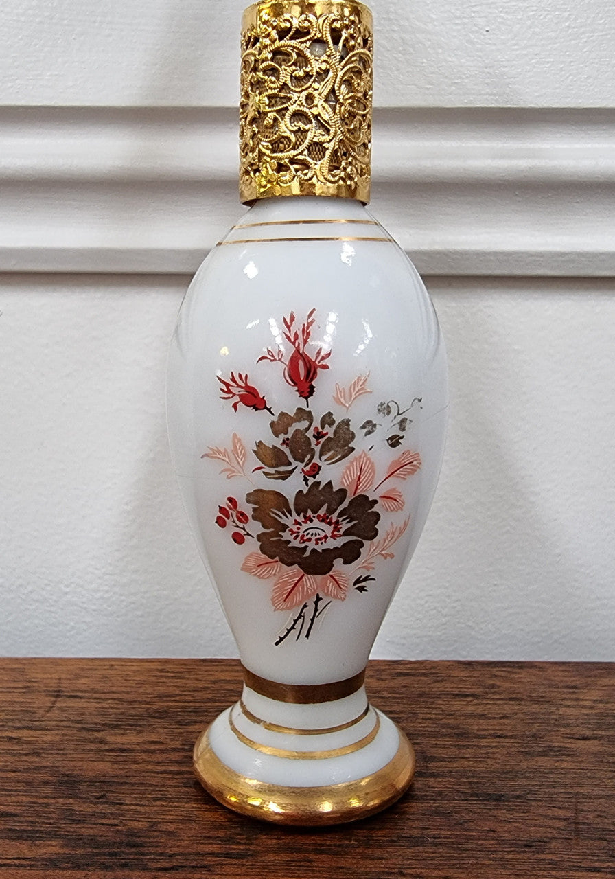 Lovely Vintage milk glass and hand painted perfume bottle with gilt, in good condition.