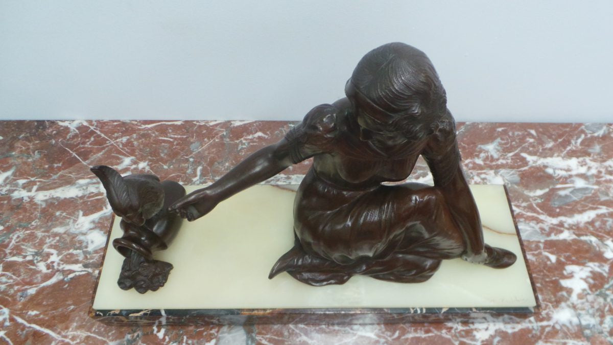 An Art Deco bronze statue with brown patina, of a lady and parrot on a marble base. Signed by Italian Sculptor A Trefoloni, an important and highly regarded sculptor. The statue is in very good condition.