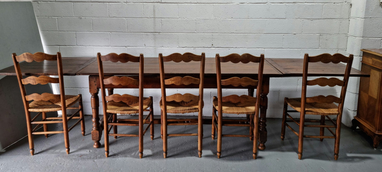 Appealing and rare French Oak Farmhouse extension table. Charming character to the top and comfortably seats 12 people. In good original detailed condition.