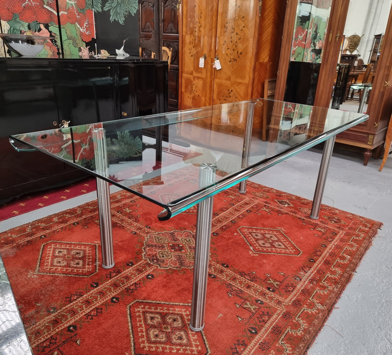 Striking and distinctive Vintage FIAM Italia Designer curved edge glass desk. FIAM was founded in 1973 by Vittorio Livio and has become synonymous with glass culture in Italy and the World. FIAM is still manufacturing today, in collaboration with various Designers, and has won numerous awards and is represented in various international museums. 
Condition: Evidence of use with minor scratches to the surface and a small chip that has been repaired. Overall, in very good condition with one repaired chip to t