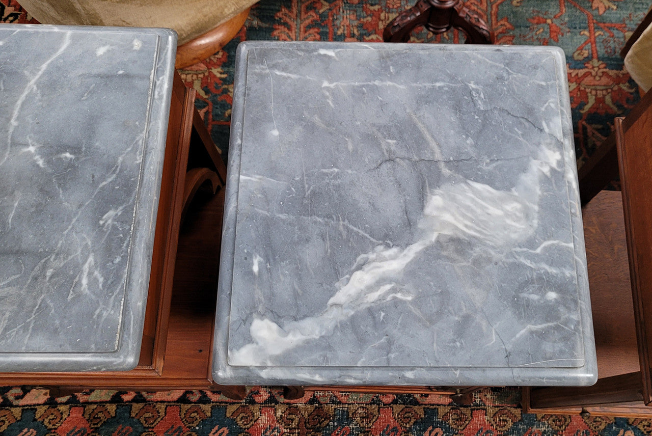 Pair of unusual transitional fruit wood marble top bedside cabinets. They have been sourced from France and are in good original detailed condition.