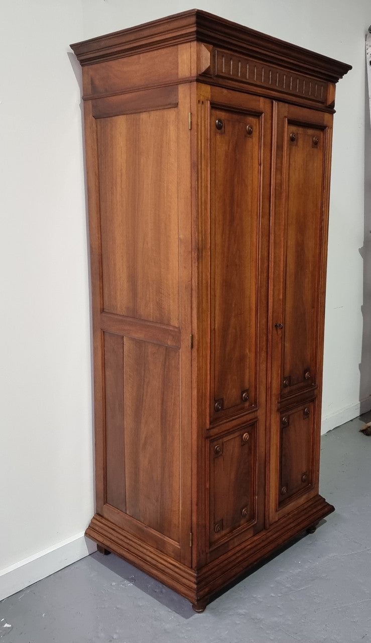 French Henry II style Walnut linen storage cupboard with nine pull out shelves. This piece could be very functional for a range of different purposes including shoe storage. It is in good original detailed condition, please note the door lock no longer functions and opens by pulling the door.