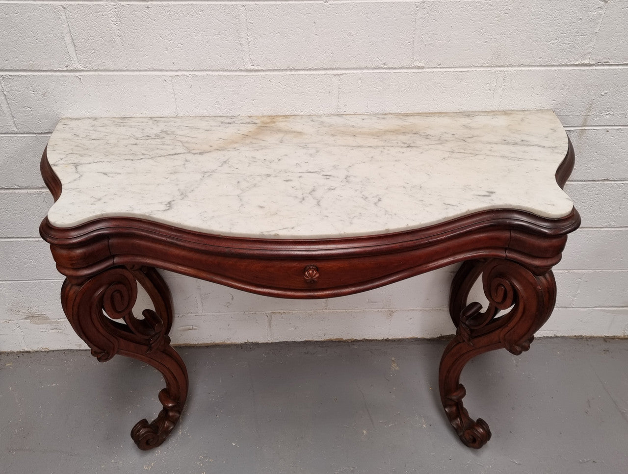 19th Century French Mahogany marble top console table. Louis XV style with white marble top and single drawer. Sourced from France and in good original detailed condition.