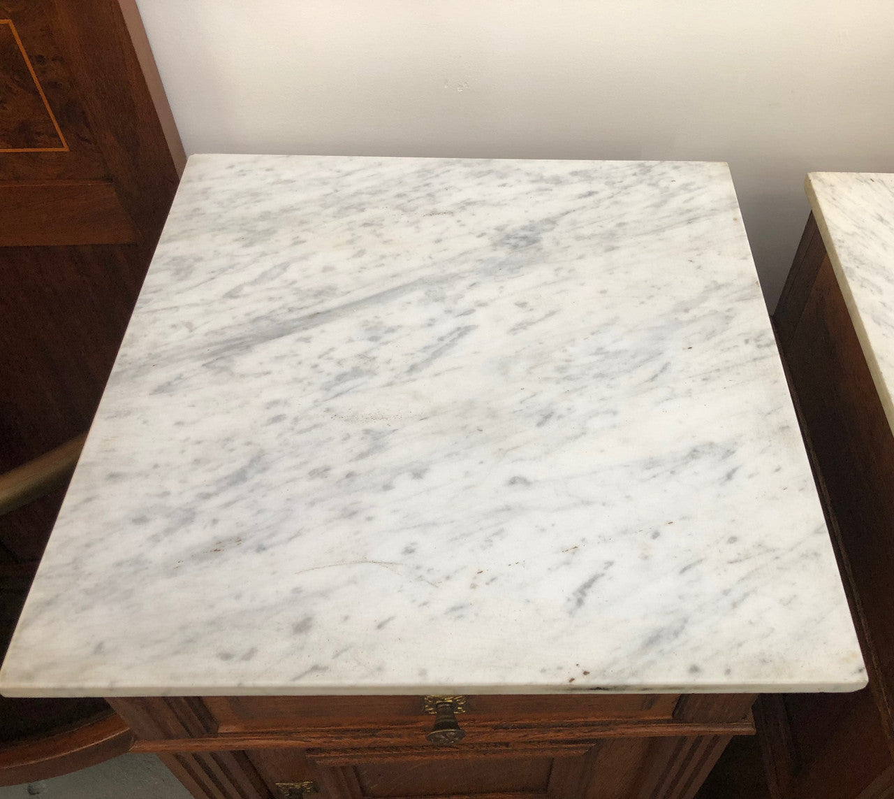A lovely pair of French Oak, marble top bedside cabinets with a cupboard and drawer in good original condition.