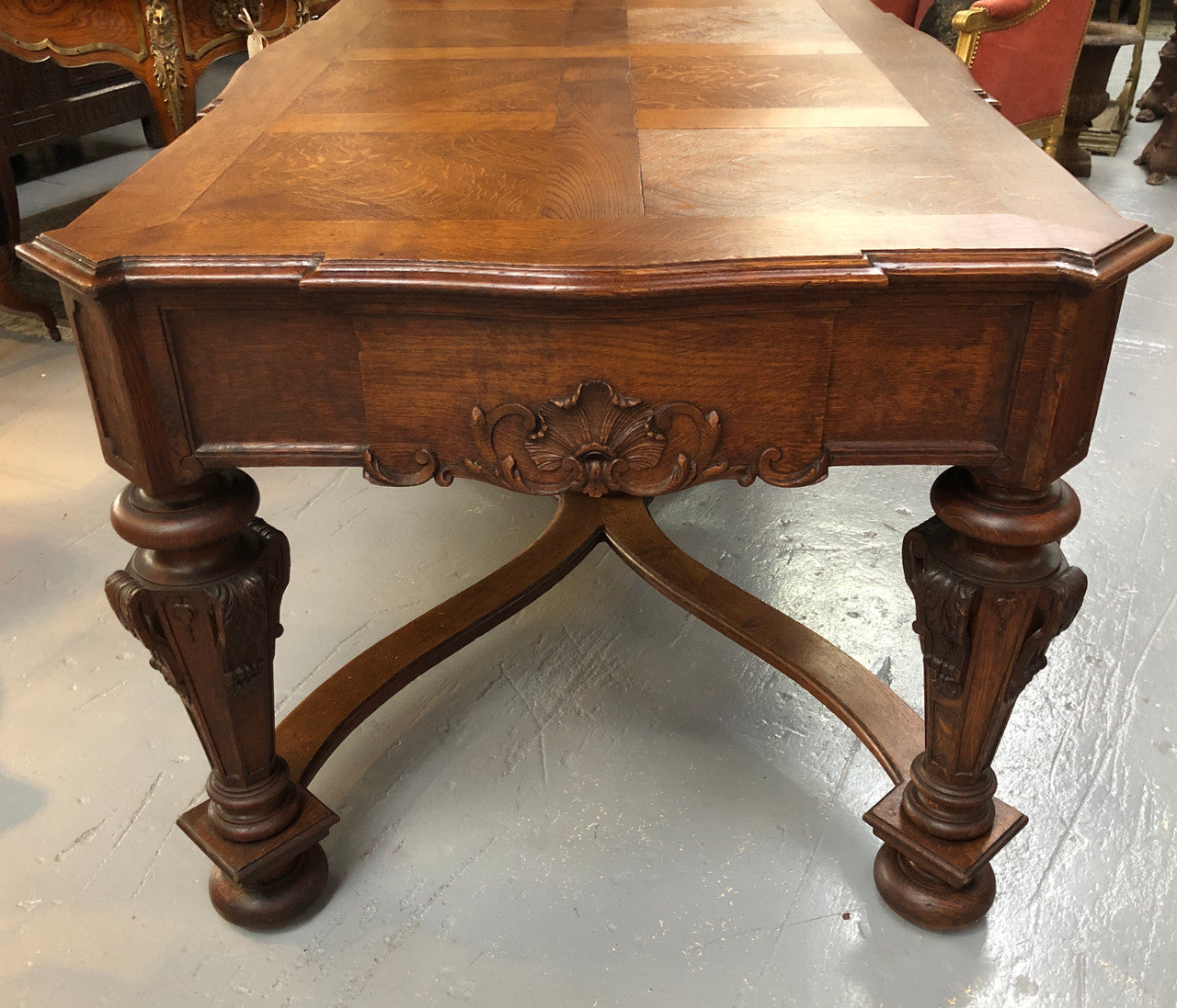 Beautifully carved 19th century French oak Bureau Plat. With a lovely parquetry top and two drawers and decorative carved legs this piece is definitely one to look at . In good original detailed condition.