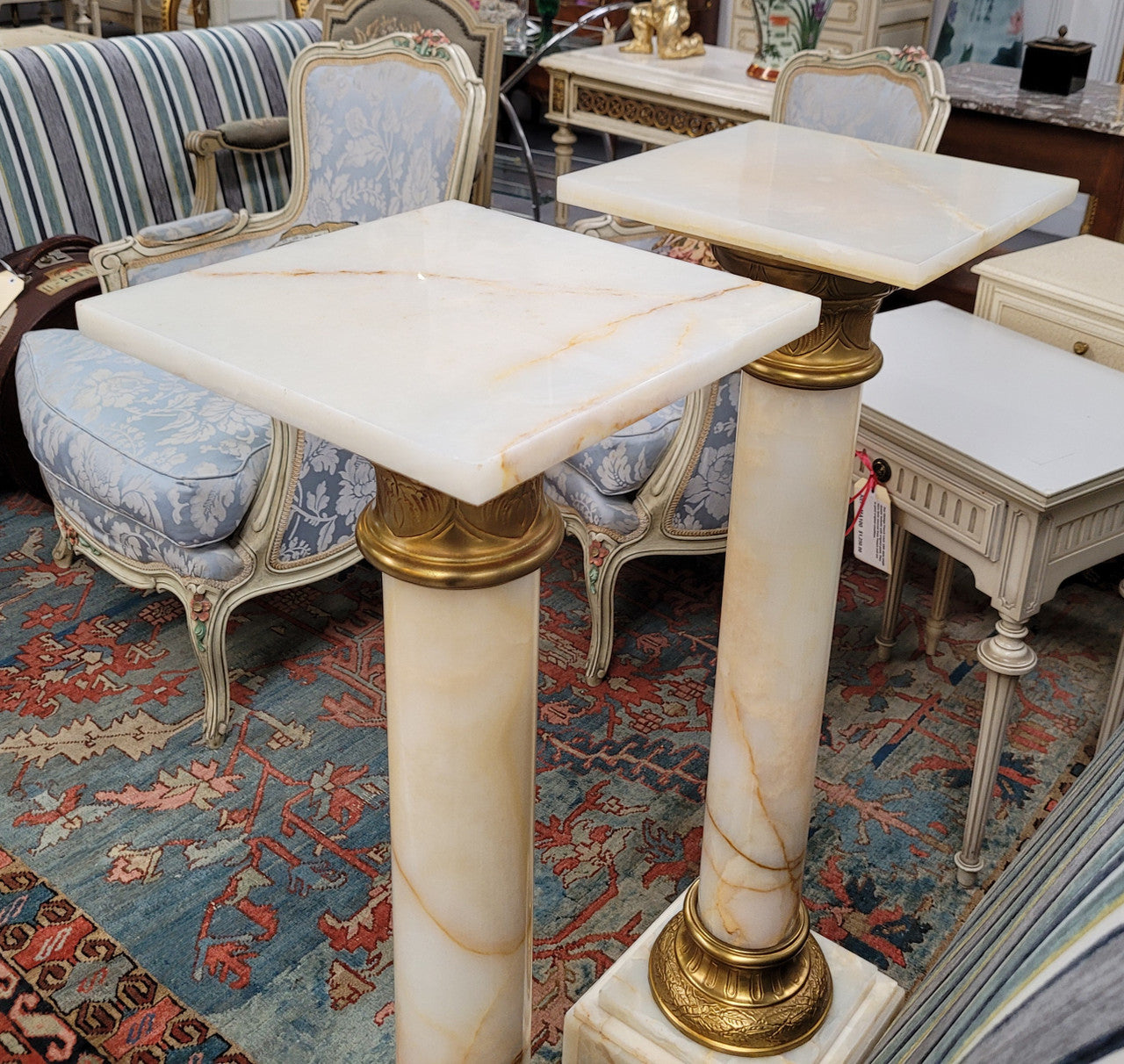 Pair of Imposing French alabaster marble and bronze pedestals. They are highly decorative and have been sourced from France. They are in good original detailed condition.