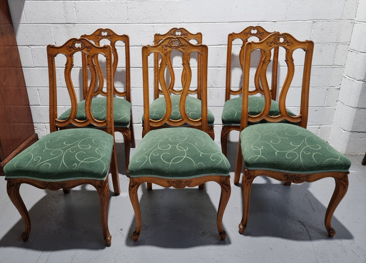 Set of six French style Oak decorative upholstered seat dining chairs. They are comfortable to sit in and are in good original condition, please view photos of fabric as the fabric is in good used condition.