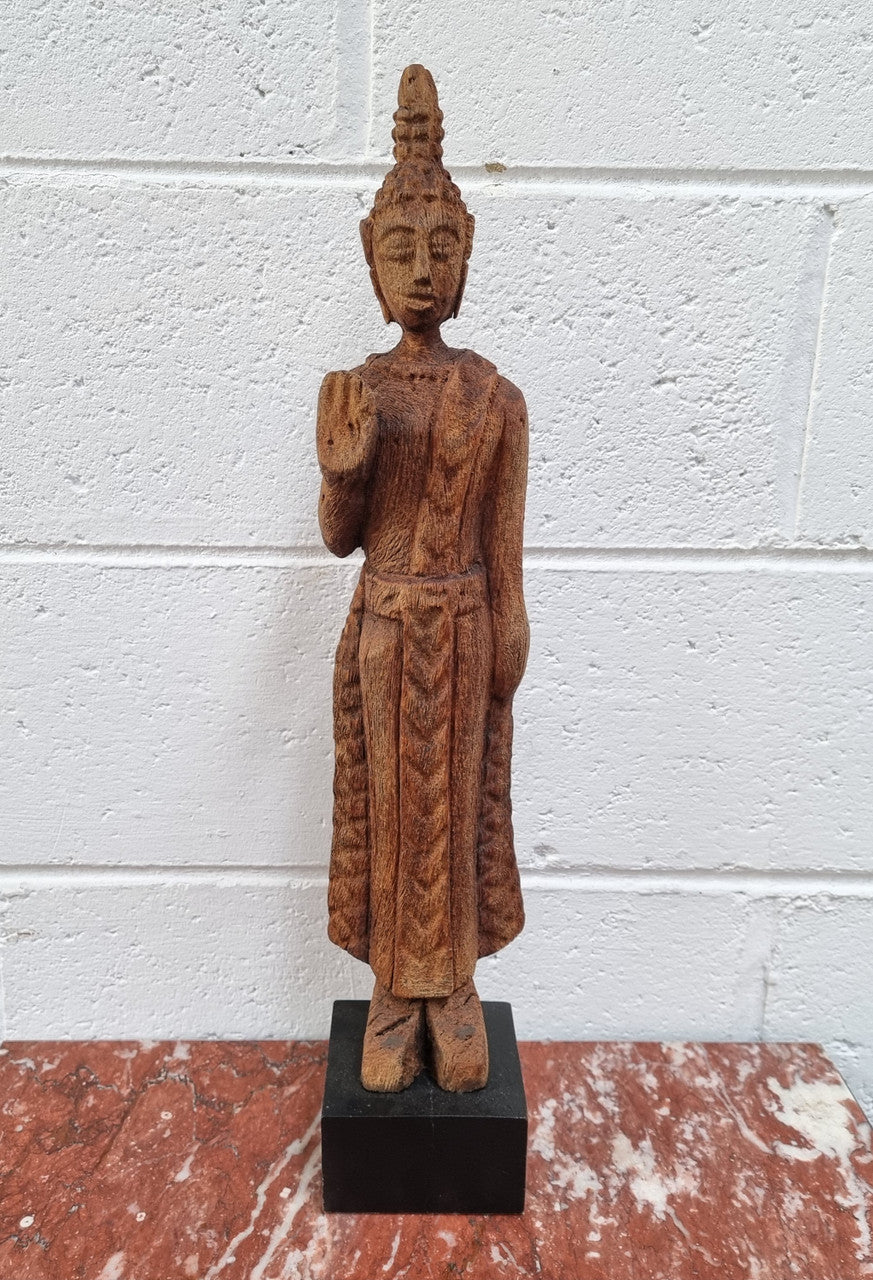 Antique Sukhothai Style Thai carving of a standing Buddha. In good original detailed condition.
