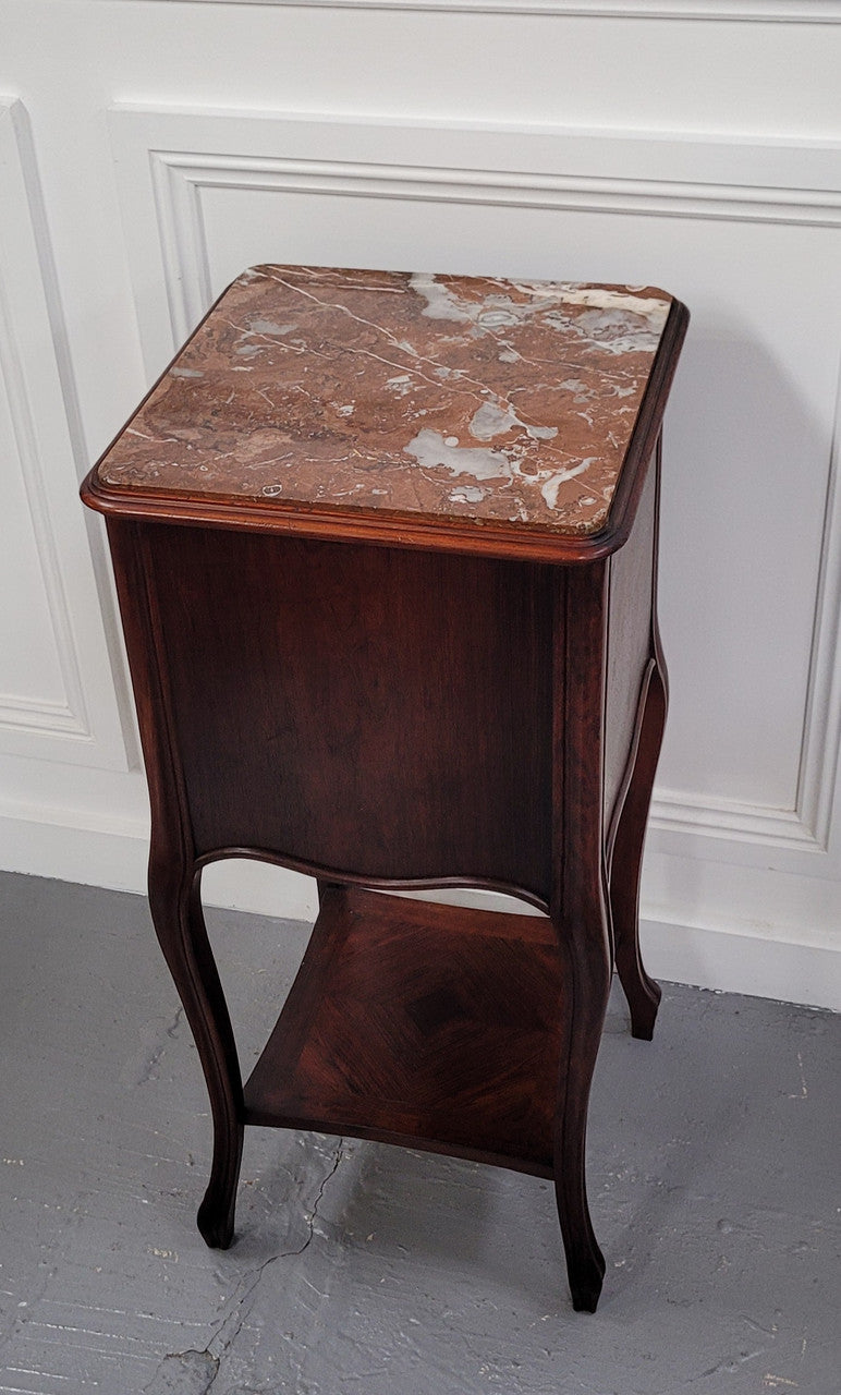 French Rosewood inset marble top single bedside cabinet with one drawer and one cupboard on elegant legs. Would also make a practical and stunning table lamp. It is in good original detailed condition.