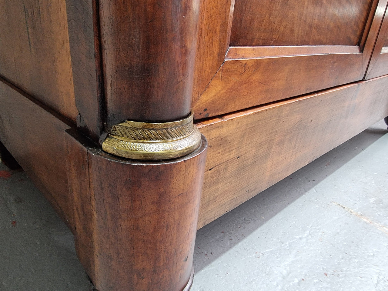 Grand French Mahogany Empire two door bookcase. It has beautiful glass doors and has three fully adjustable shelves. It has been sourced from France and is in good original detailed condition.